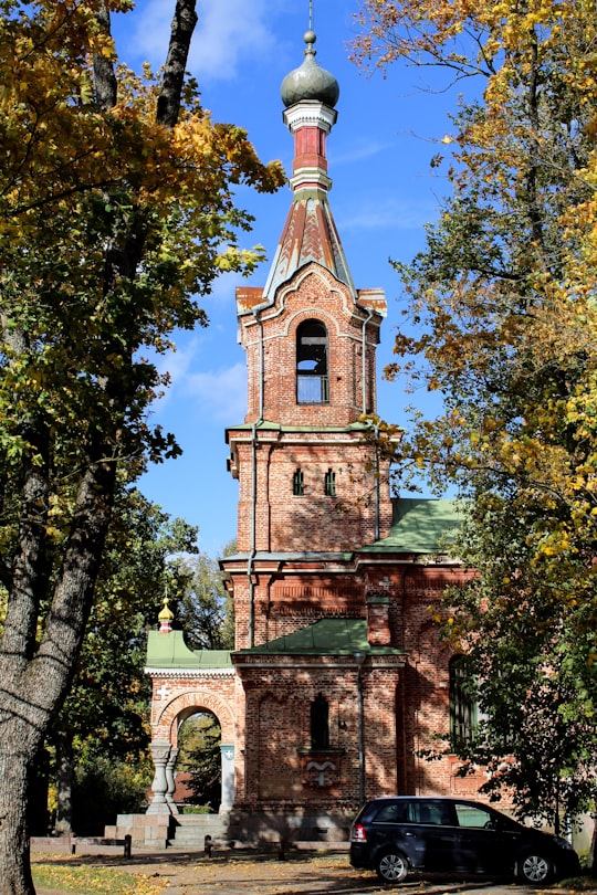 brown concrete tower during daytime in Kuldīga Latvia