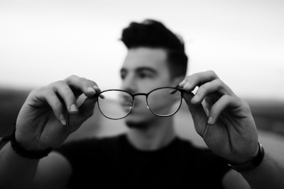 An inspiring photo of a person receiving glasses for the first time.