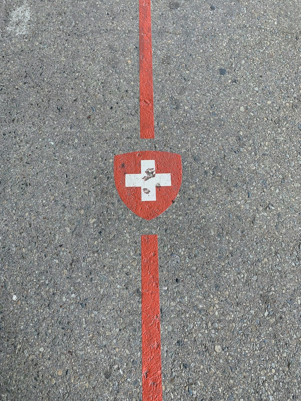 red and white cross logo