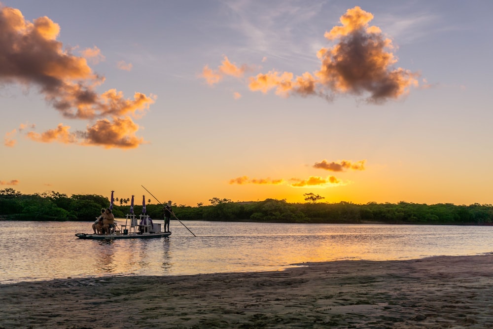 boat sails at the river during golden hour