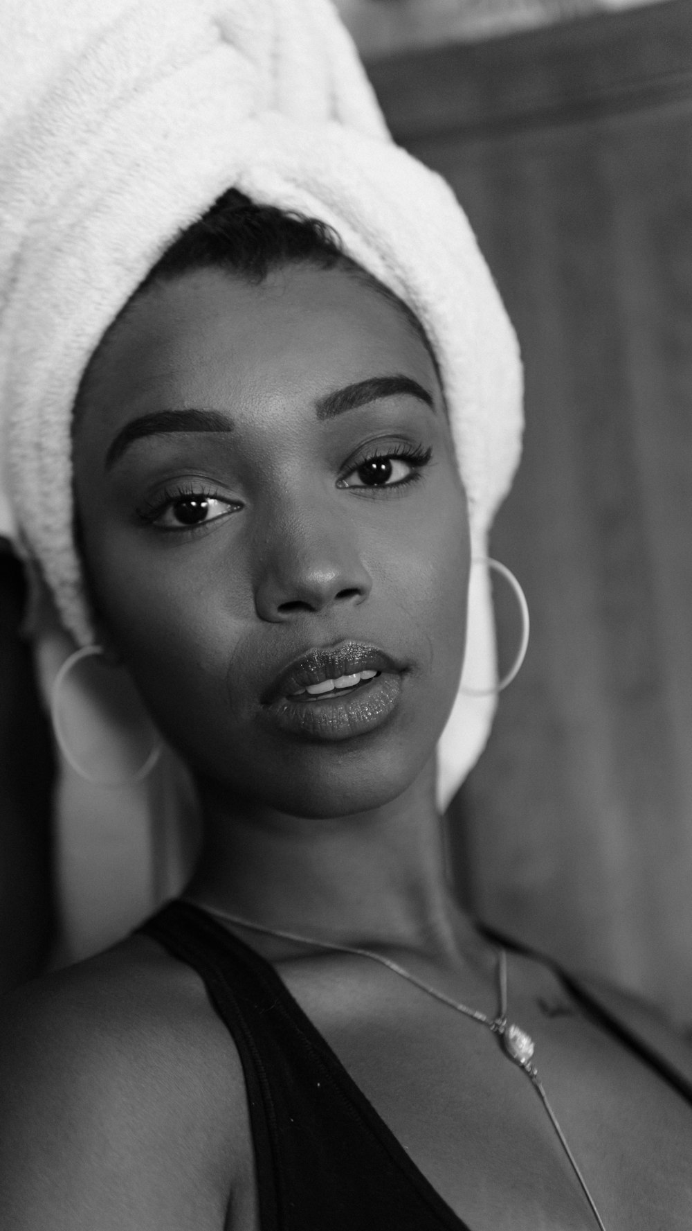 grayscale photo of woman wearing black top