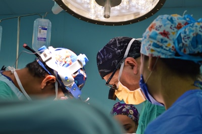 doctors wearing assorted-color scrub shirts