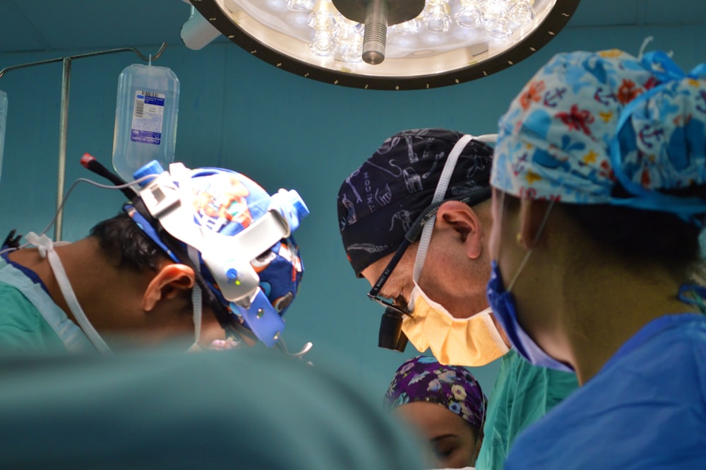 doctors wearing assorted-color scrub shirts