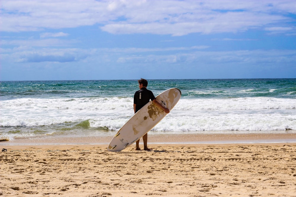 man holding surfingboard