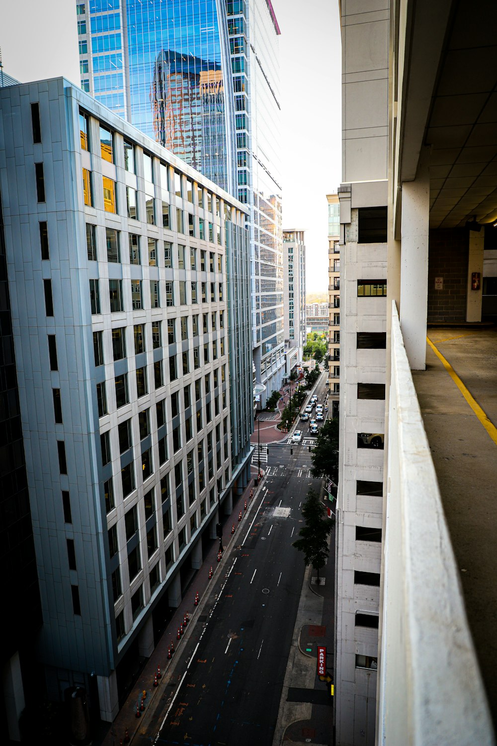 high rise buildings and cars on road