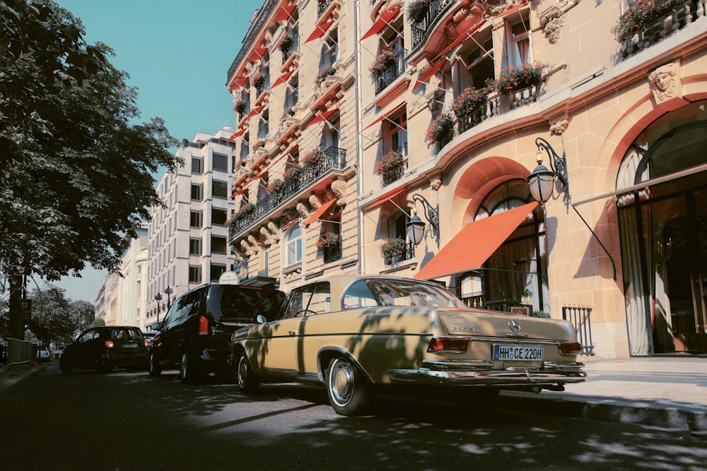 different vehicles on road near building during daytime