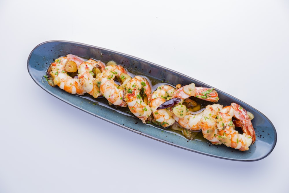 shrimp dish in gray oblong plate