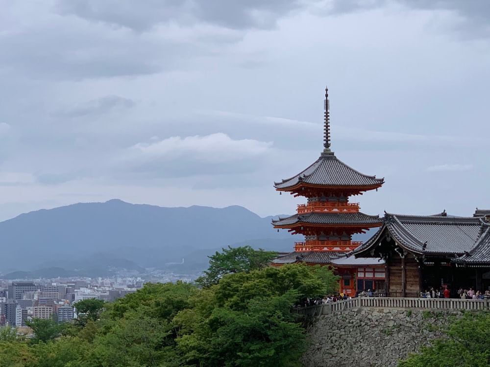 red and gray temple under white sky