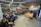 A diverse group of people engaged in a lively discussion in a bright room.