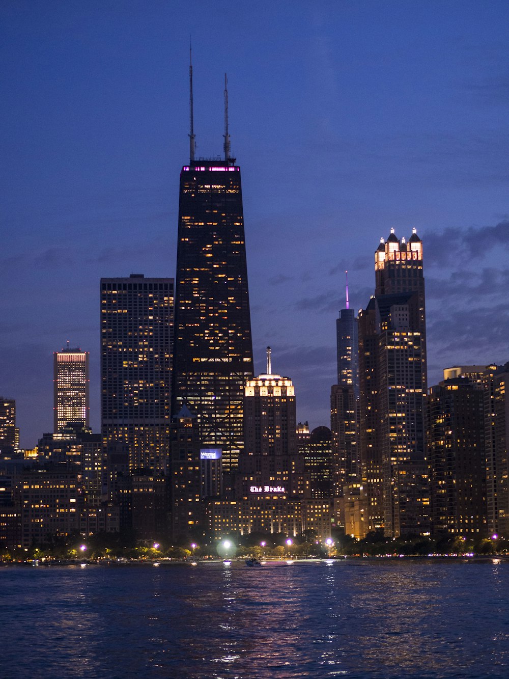 a view of a city at night from the water