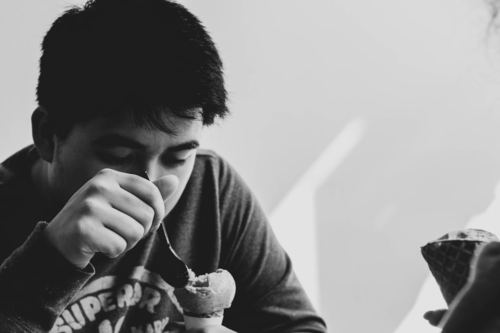 man eating ice cream with spoon