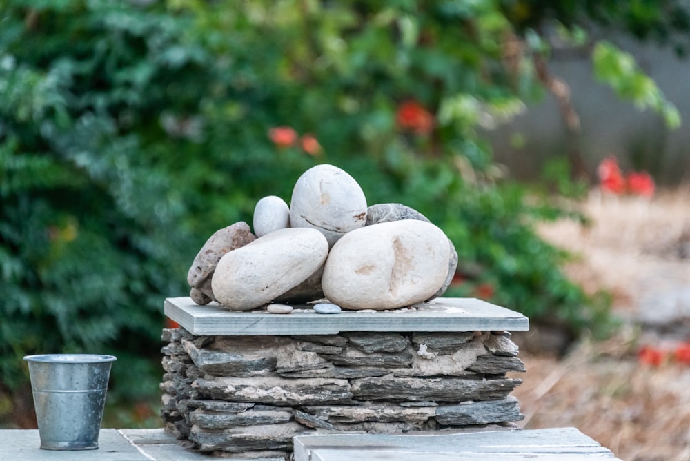 pile of stones near cup