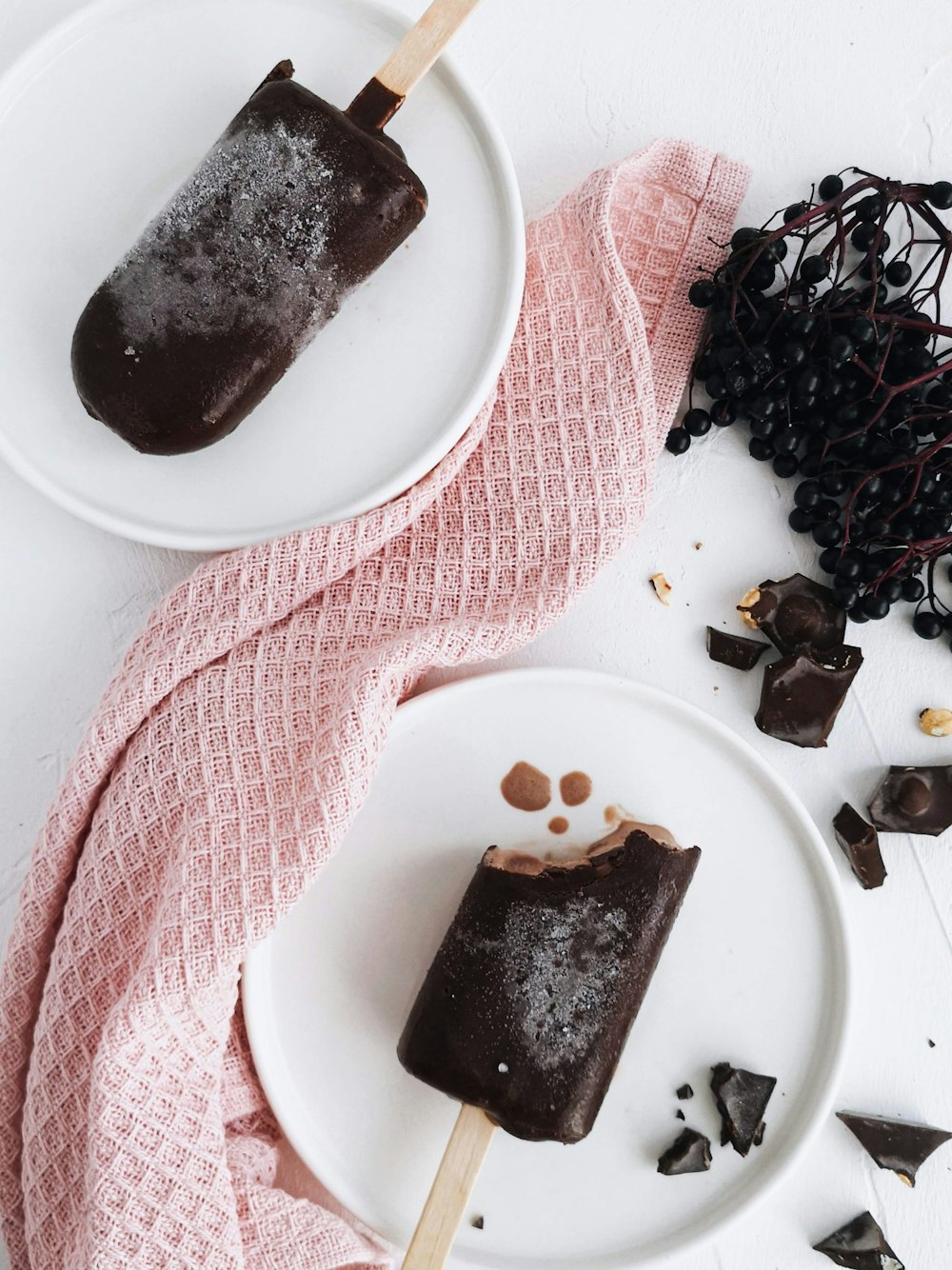 chocolate ice pops on white plates