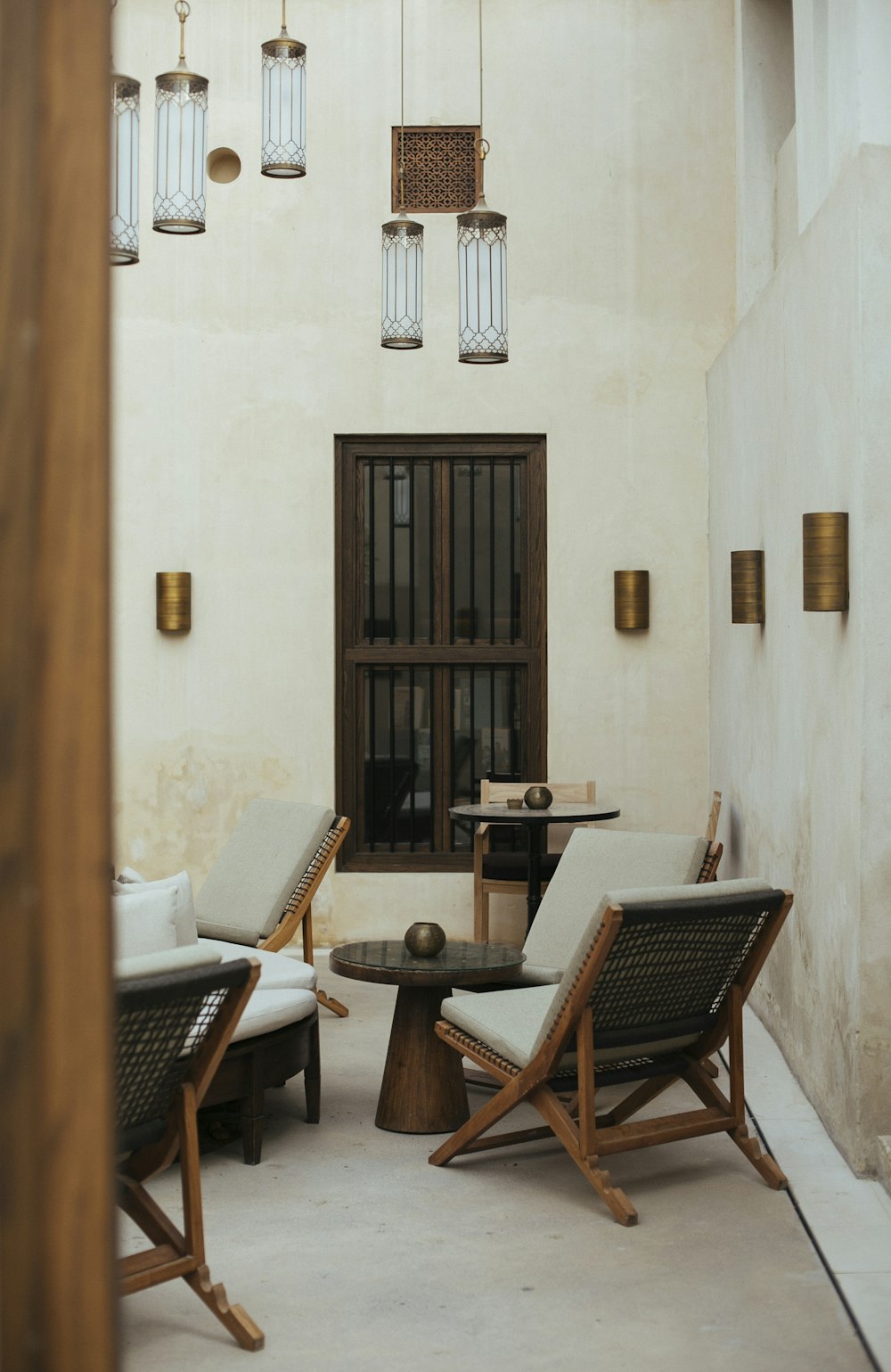 brown wooden armless chairs near table