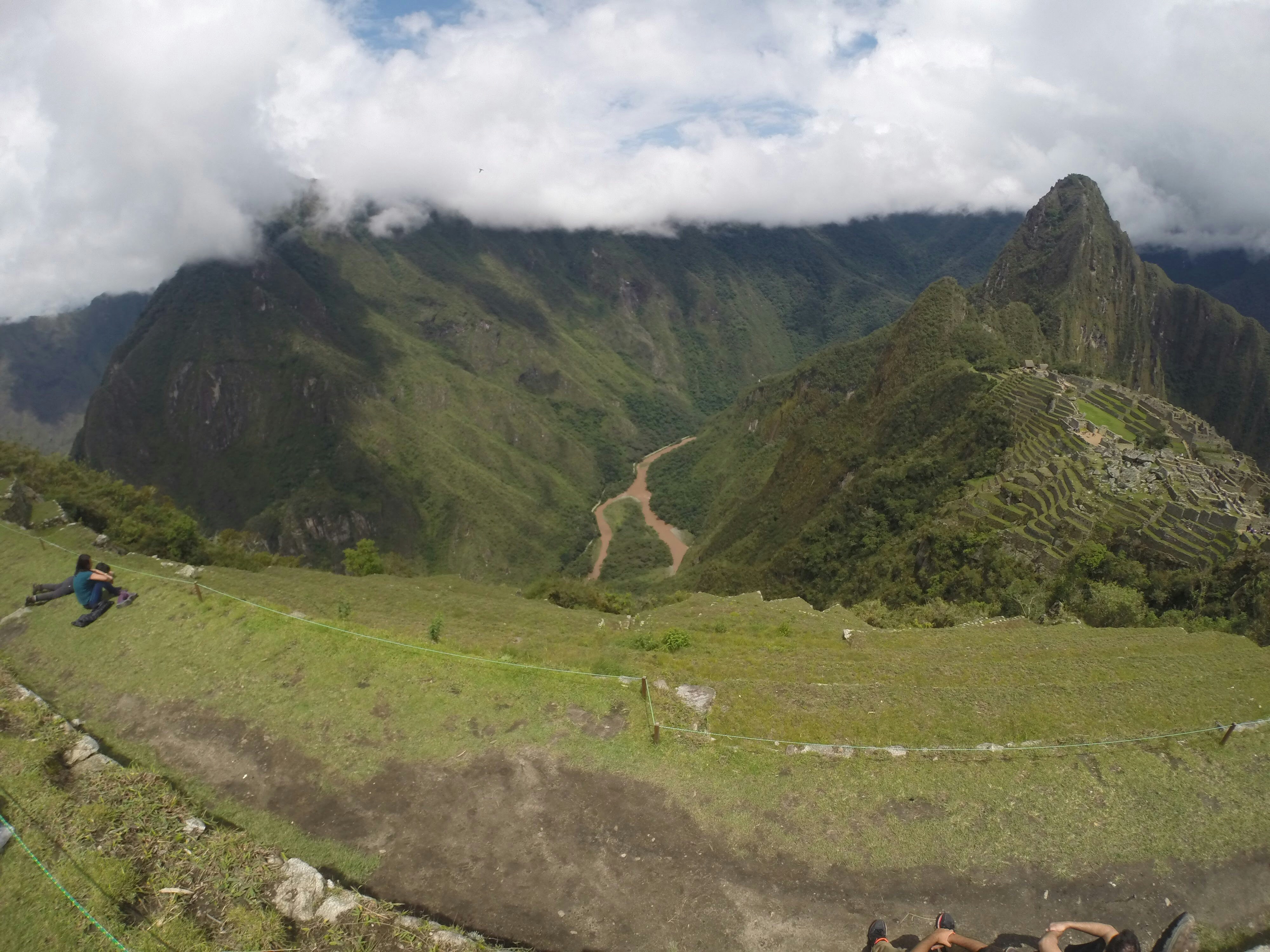 Machu Picchu ruins with Andean peaks above the clouds