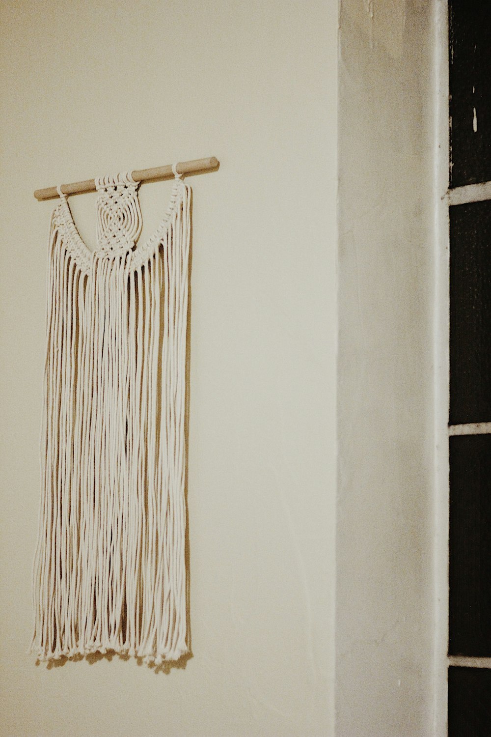 white fringe wall decor