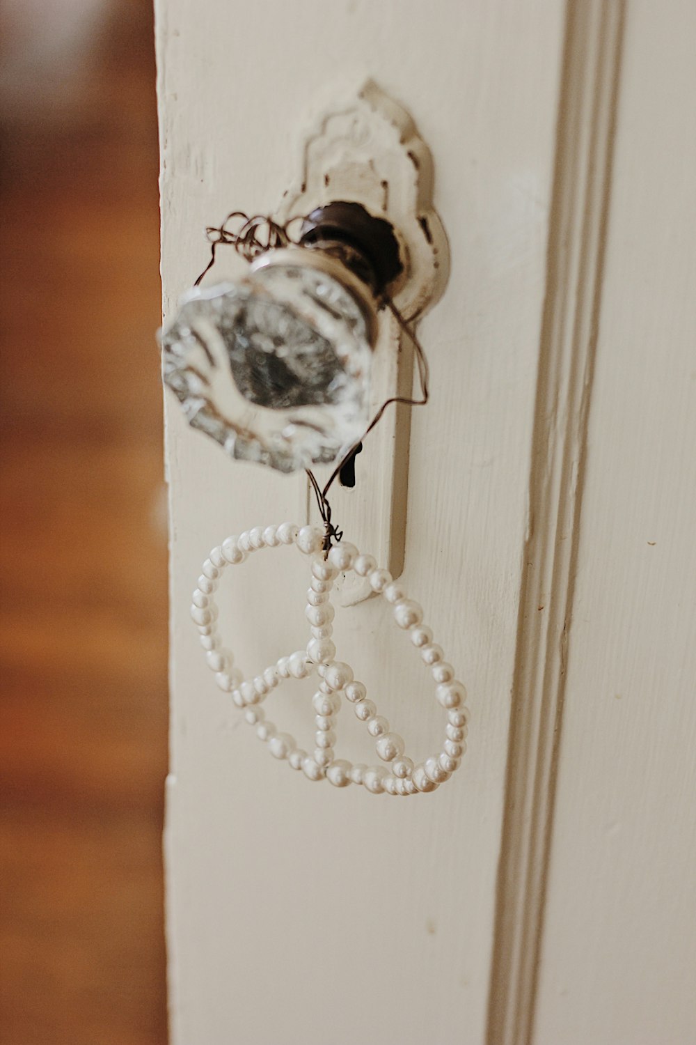 peace decor hung on door knob