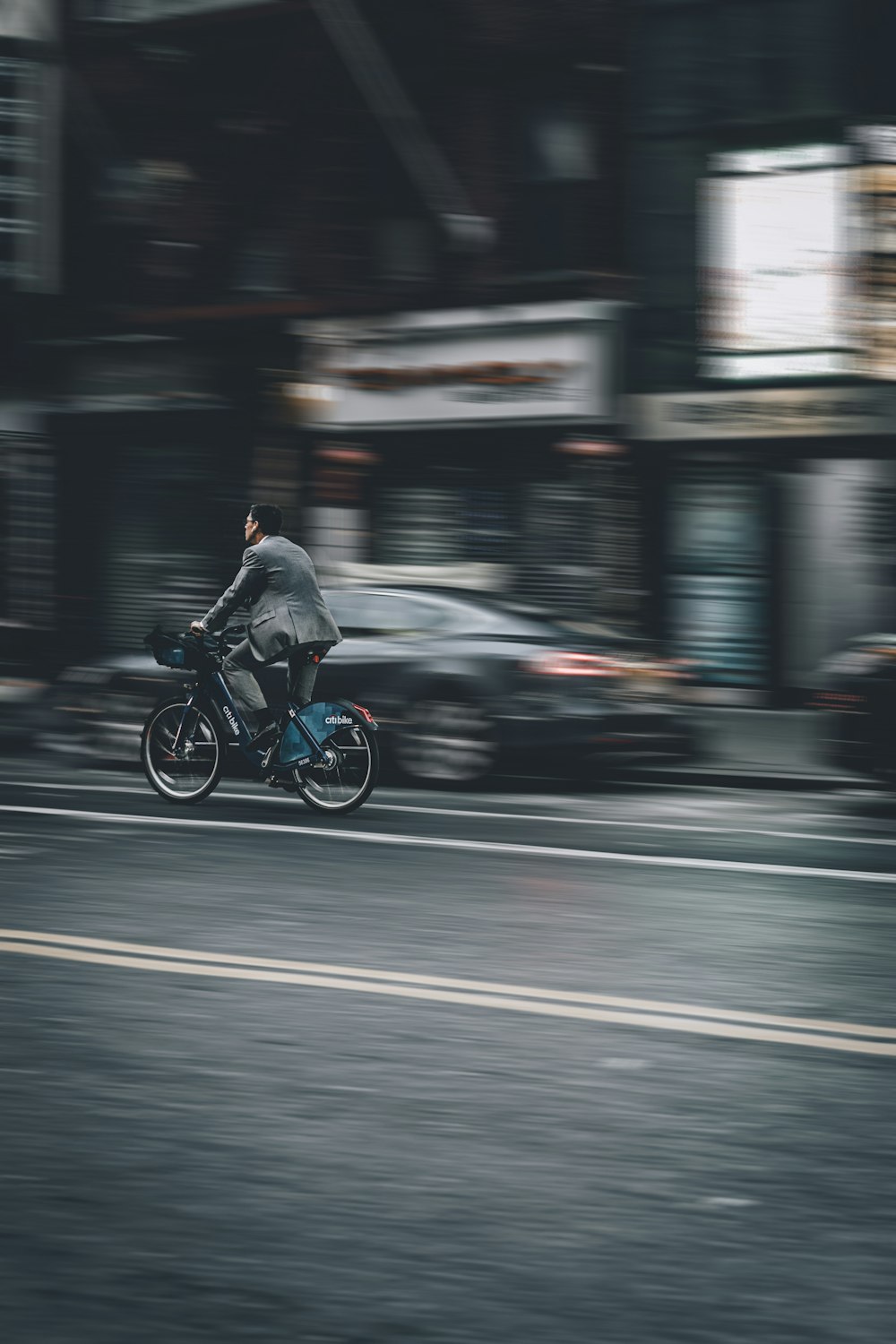 person riding bicycle on road