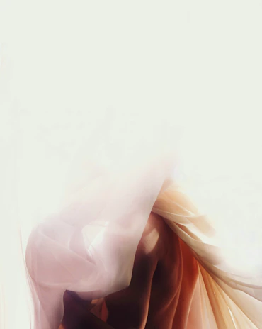 Delicate silhouette of a woman bathed in warm champagne light, evoking quiet devotion.