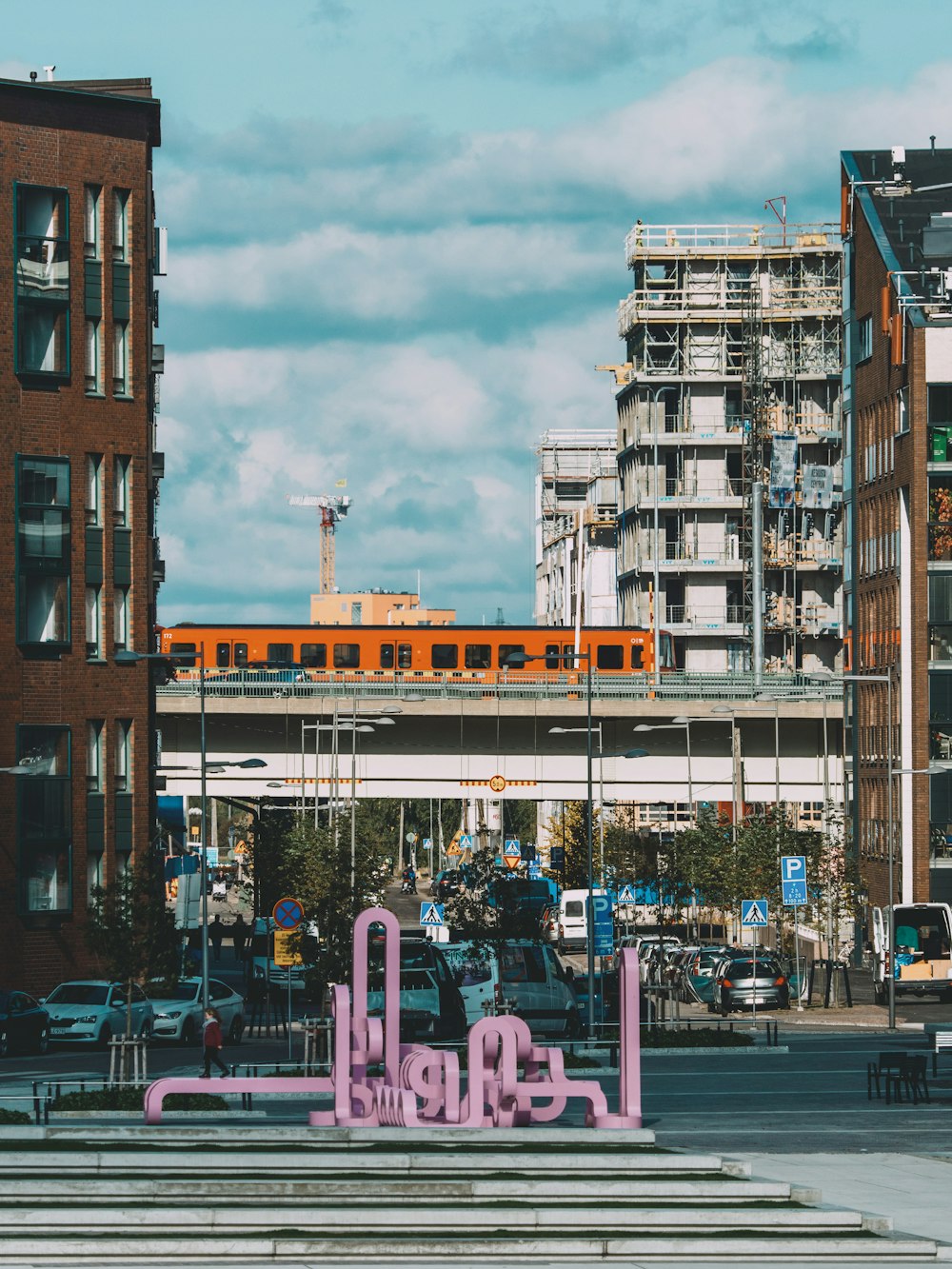 pink frames near buildings