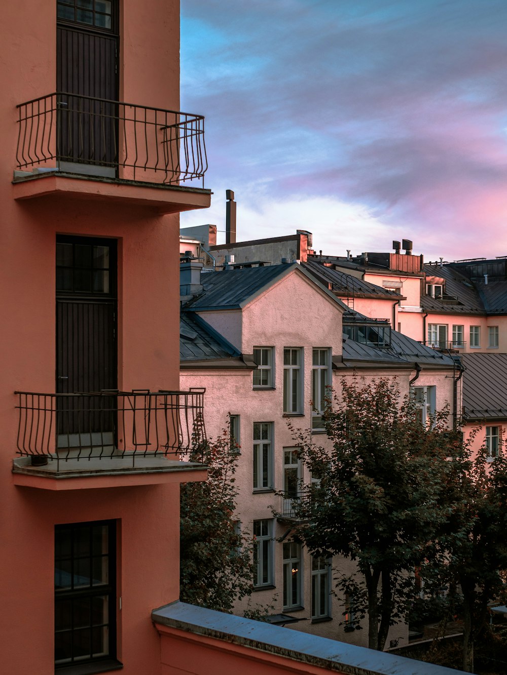 white painted buildings under gray sky