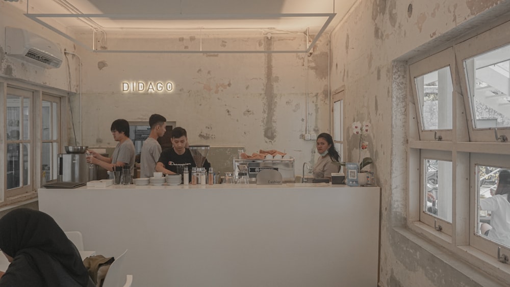 people serving inside restaurant