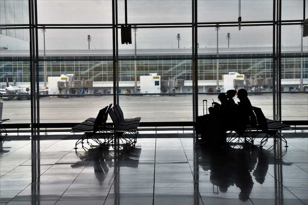 silhouette of people sitting on gangchair