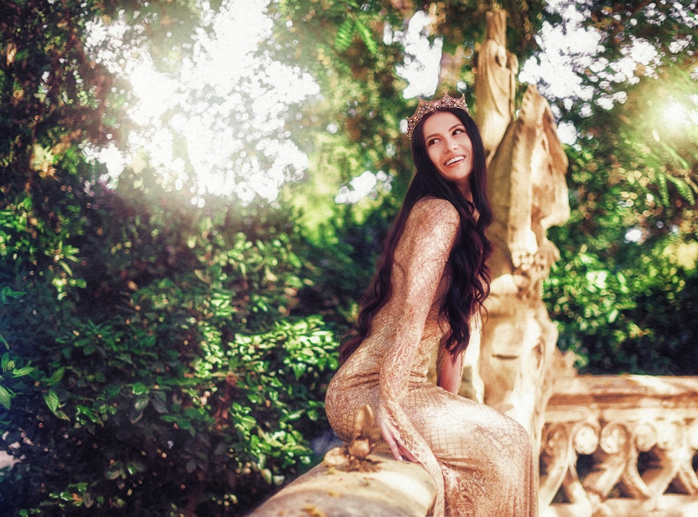 woman wearing beige long-sleeved dress