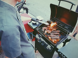 person grilling meat