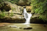 A picturesque view of Soochipara Waterfalls cascading down rocky cliffs.