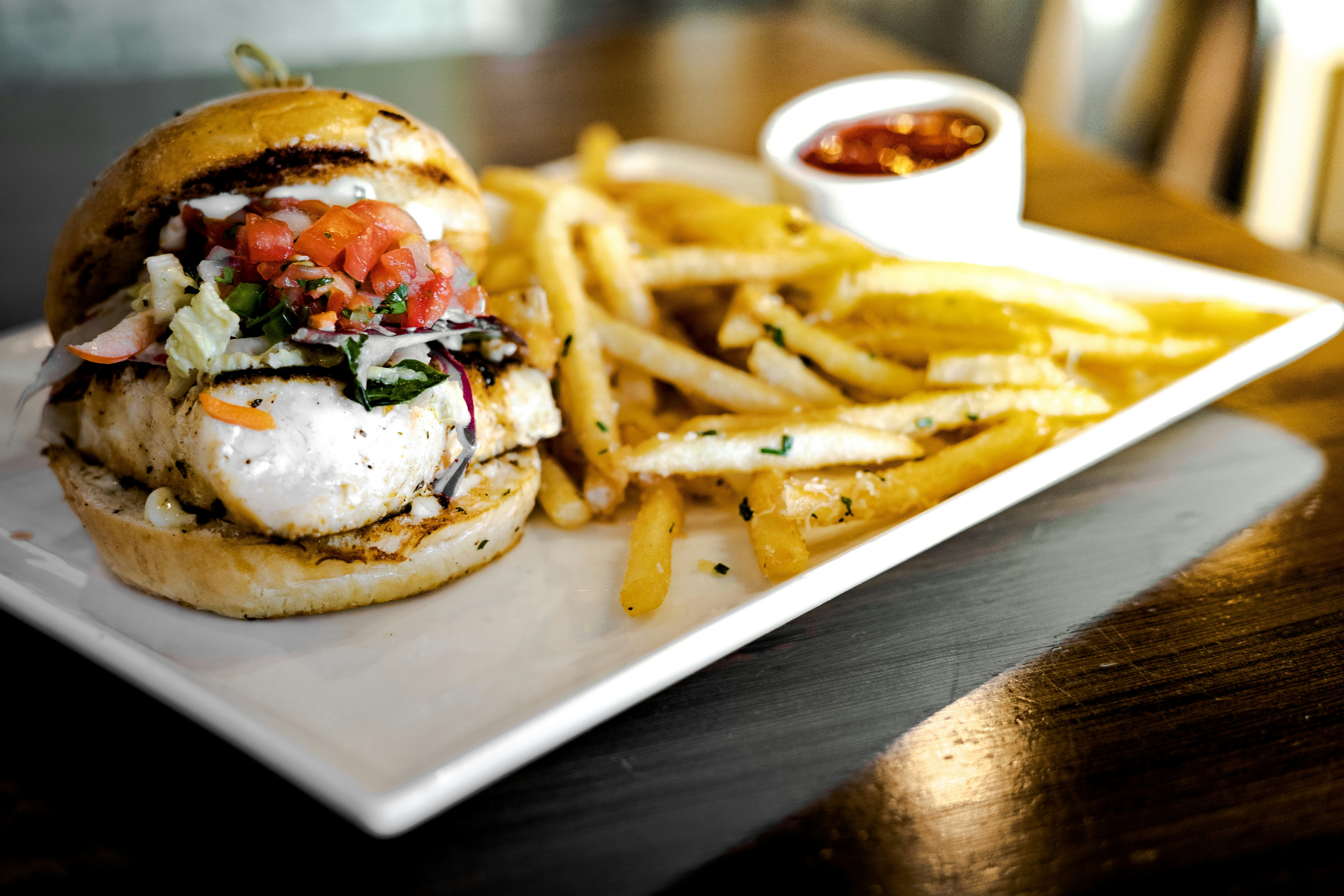 Chicken burger and fries on a plate