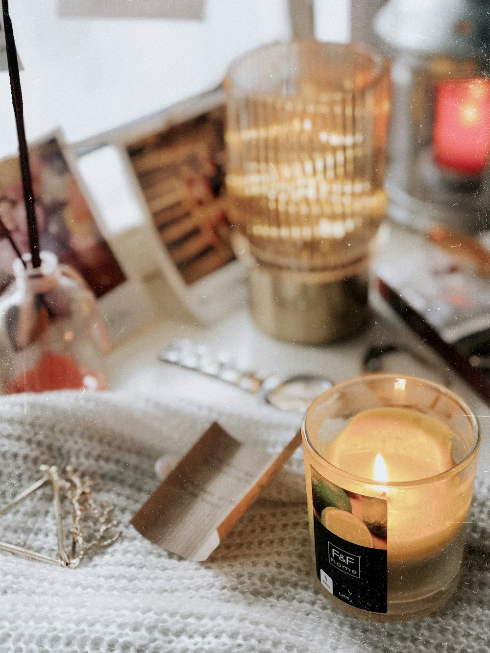 clear glass cup with candle