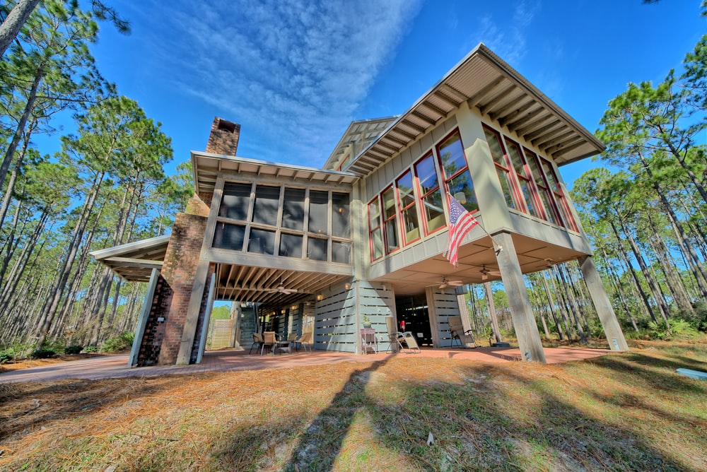 house between forest view during daytime