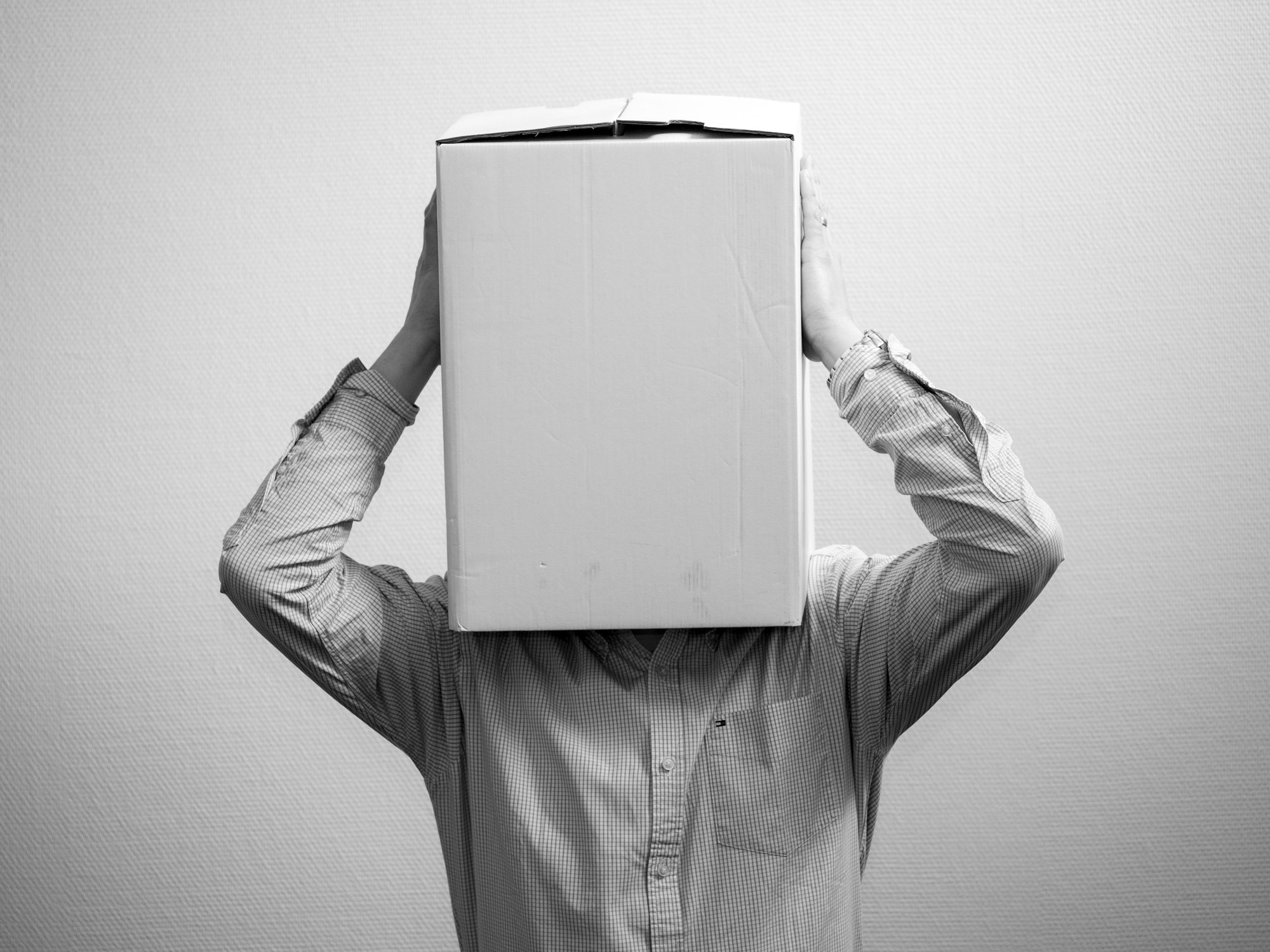 man with a box over his head