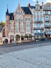 vehicle beside buildings during daytime