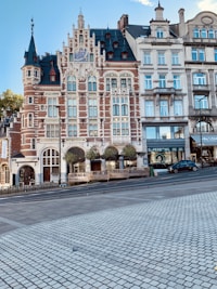 vehicle beside buildings during daytime