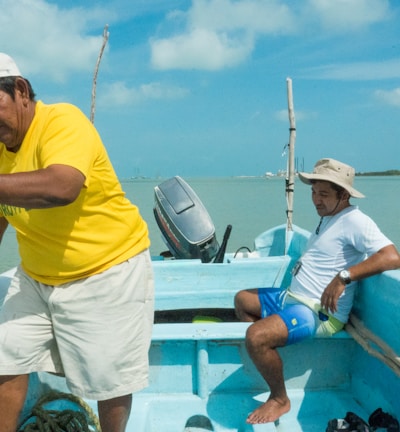 men riding on boat