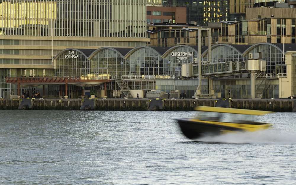 yellow and black power boat