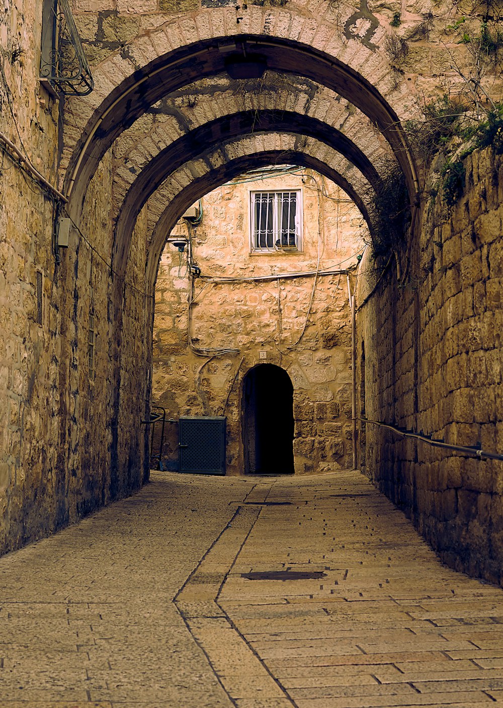 a tunnel with a clock on the side of it