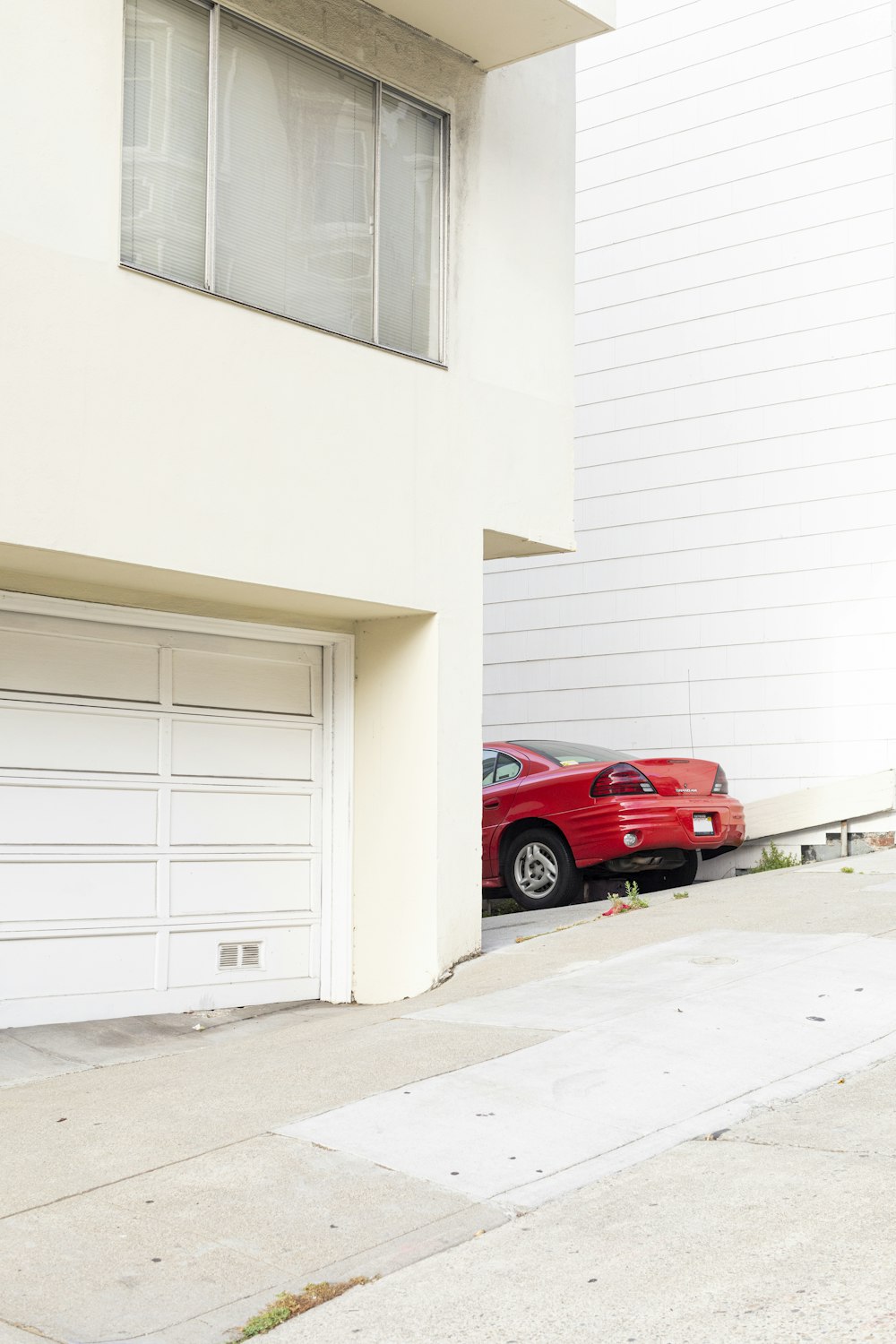 red car beside building