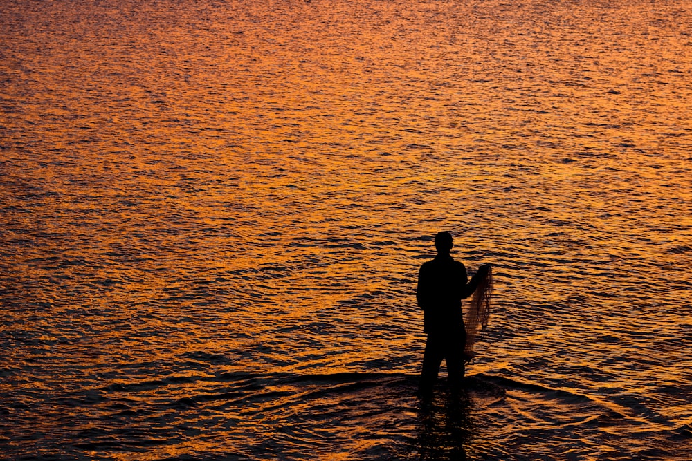 person standing on seashore