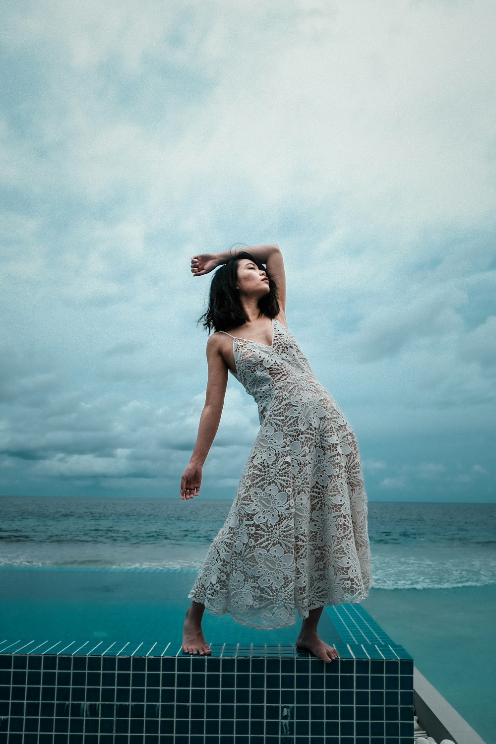 woman standing on tiled surface