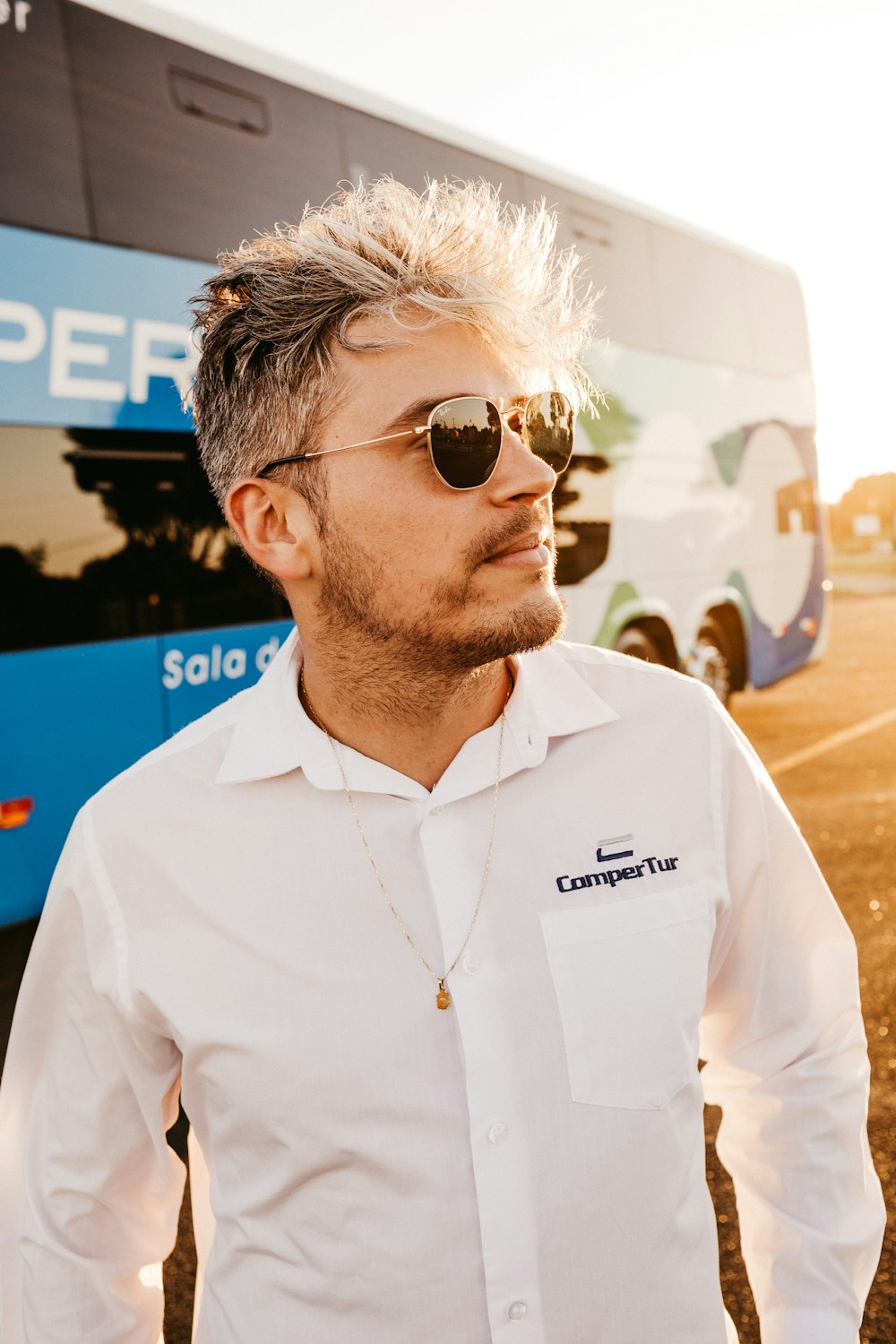 man standing near bus