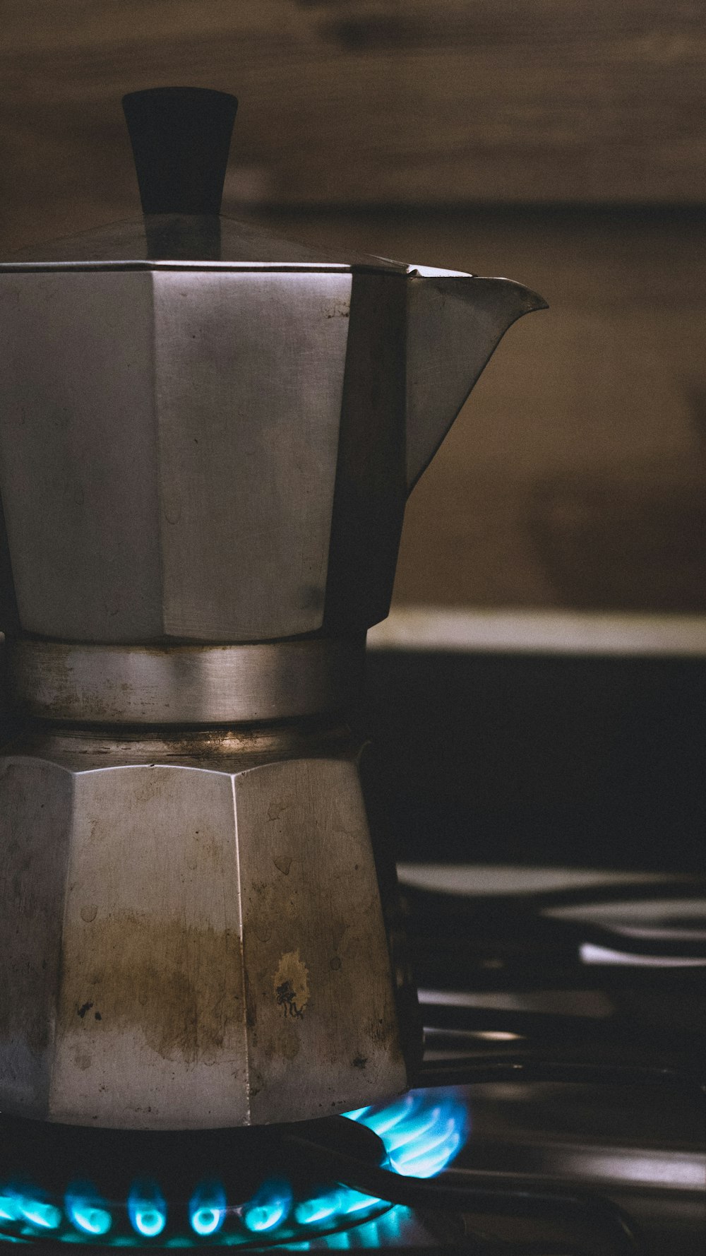 a stove top with a blue flame coming out of it