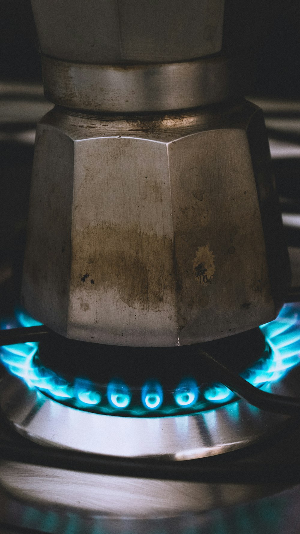 a stove top with a blue flame coming out of it