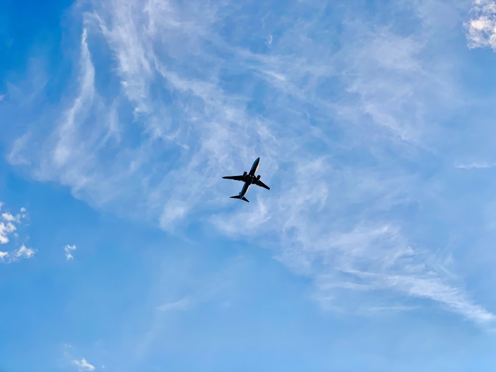 airplane in mid air during day