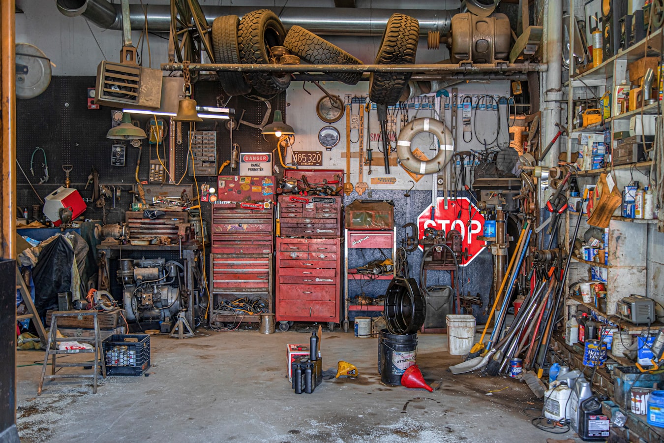 Cluttered garage full of junk and tools