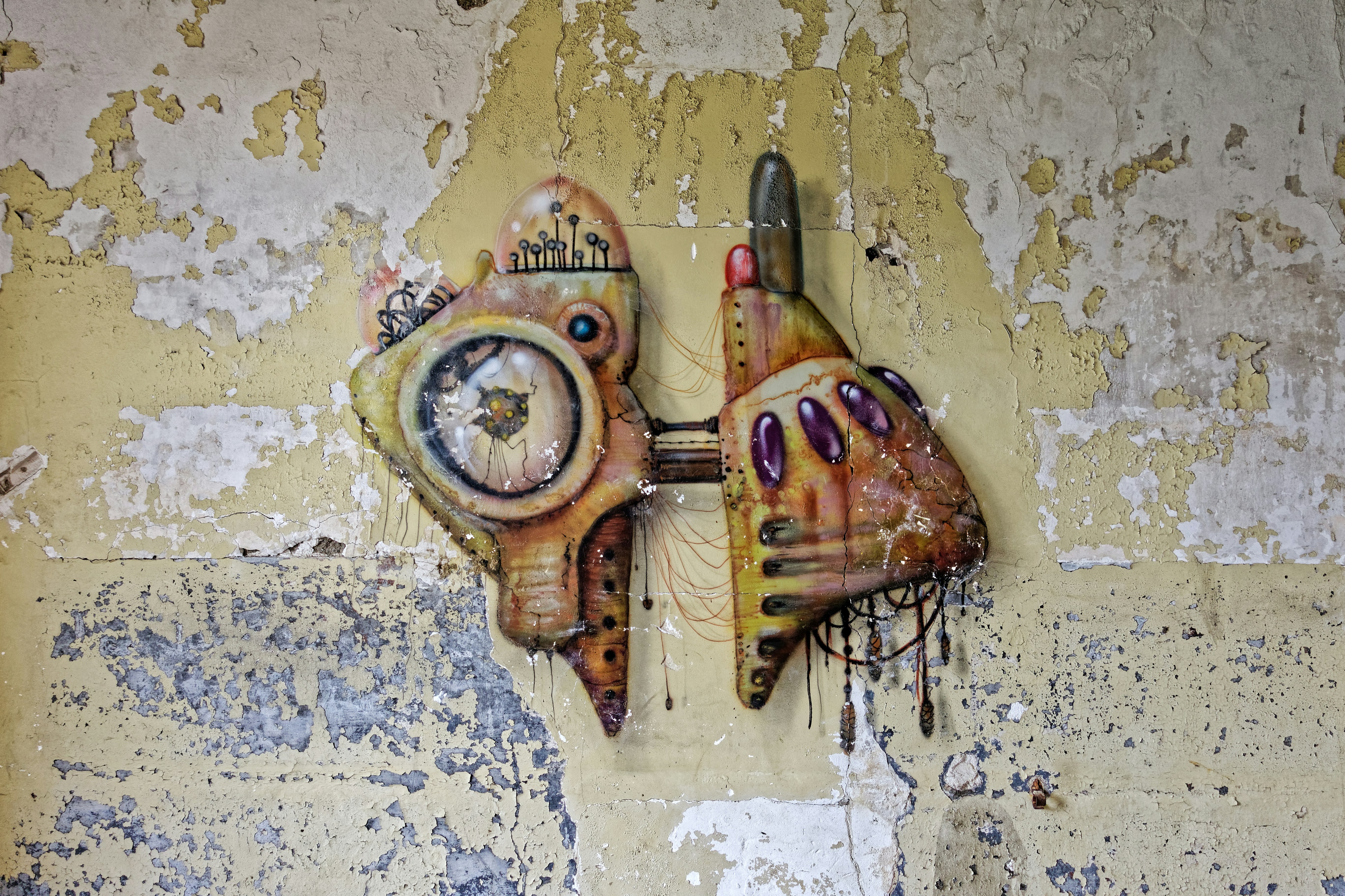 a piece of art on a wall with a clock on it