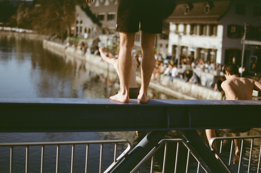 man on a metal bridge