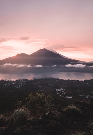 river near mountain during sunrise